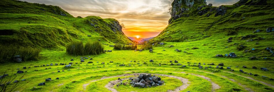 green grass field during sunset
